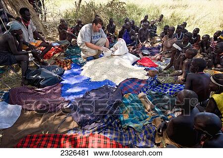 Ethiopia, South Western Ethiopia, Omo Valley, Southern Mursiland, View of archaeologist with Mursi people; Dirikoro View Large Photo Image Stock Image - Ethiopia, South Western Ethiopia, Omo Valley, Southern Mursiland, View of archaeologist with Mursi people; Dirikoro. Fotosearch