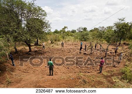 Ethiopia, South Western Ethiopia, Omo Valley, Southern Mursiland, View of Mursi people and archeologists on field; Dirikoro View Large Photo Image Stock Photo - Ethiopia, South Western Ethiopia, Omo Valley, Southern Mursiland, View of Mursi people and archeologists on field; Dirikoro. Fotosearch