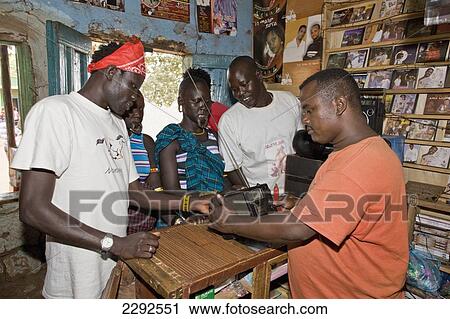 Ethiopia, Southern Nations Nationalities And Peoples' Region, South Omo, Members Of Mursi Tribe Buying Radio; Jinka View Large Photo Image Stock Image - Ethiopia, Southern Nations Nationalities And Peoples' Region, South Omo, Members Of Mursi Tribe Buying Radio; Jinka. Fotosearch