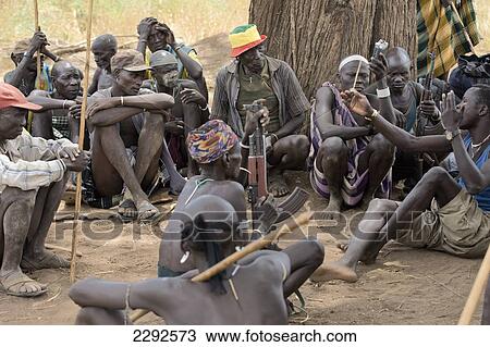 Stock Image - Ethiopia, Southern Nations Nationalities And Peoples' Region, South Omo, Mursiland, Public Debate (Tama) Under Shadow Of Big Tree; Sholbi Village. Fotosearch