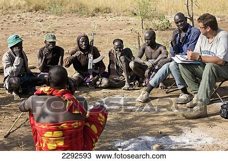 Ethiopia, Southern Nations Nationalities And Peoples' Region, South Omo, Southern Mursiland, Public Debate Of Mursi Tribesmen With Archaeologist; Dirikoro View Large Photo Image Stock Image - Ethiopia, Southern Nations Nationalities And Peoples' Region, South Omo, Southern Mursiland, Public Debate Of Mursi Tribesmen With Archaeologist; Dirikoro. Fotosearch