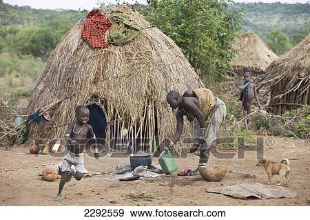 Ethiopia, Southern Nations Nationalities And People's Region, South Omo, Mursiland, View Of Traditional Dwelling Of Mursi Tribe (Dori); Makki Village View Large Photo Image Stock Photo - Ethiopia, Southern Nations Nationalities And People's Region, South Omo, Mursiland, View Of Traditional Dwelling Of Mursi Tribe (Dori); Makki Village. Fotosearch