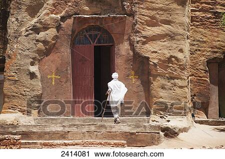 Ethiopian Orthodox christian entering Wukro Chirkos rock-cut church; Wukro, Tigray region, Ethiopia View Large Photo Image Stock Image - Ethiopian Orthodox christian entering Wukro Chirkos rock-cut church; Wukro, Tigray region, Ethiopia. Fotosearch