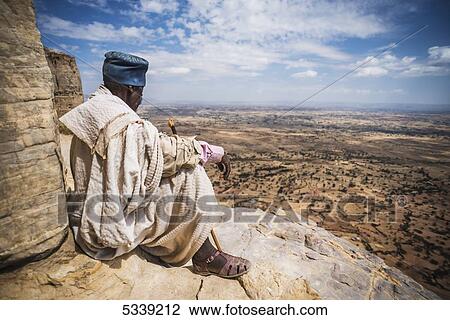 Ethiopian Orthodox Christian priest; Lalibela, Ethiopia View Large Photo Image Stock Image - Ethiopian Orthodox Christian priest; Lalibela, Ethiopia. Fotosearch