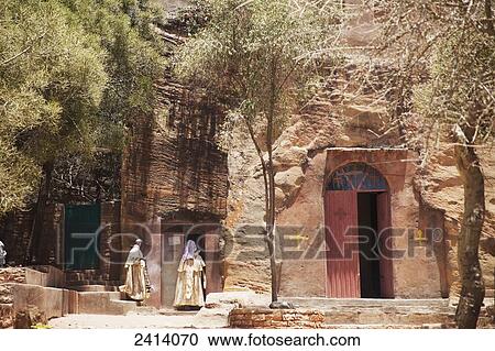 Ethiopian Orthodox priests entering Wukro Chirkos rock-cut church; Wukro, Tigray region, Ethiopia View Large Photo Image Stock Image - Ethiopian Orthodox priests entering Wukro Chirkos rock-cut church; Wukro, Tigray region, Ethiopia. Fotosearch