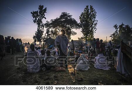 Stock Photo - Ethiopian pilgrims at dawn; Lalibela, Ethiopia. Fotosearch