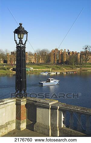 Europe, Uk, England, London, Surrey, Hampton Court Seen From Across River Thames View Large Photo Image Stock Image - Europe, Uk, England, London, Surrey, Hampton Court Seen From Across River Thames. Fotosearch