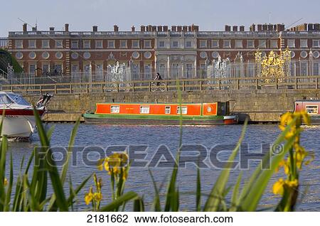Stock Image - Europe, Uk, Gb, England, London, Surrey, Hampton Court Seen From Across River Thames. Fotosearch