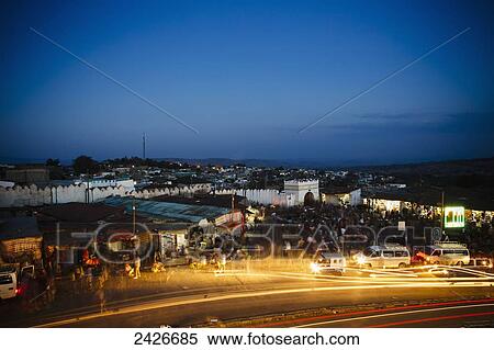 Stock Photography - Evening scene around the main gate into the old city of Harar in Eastern Ethiopia; Harar, Ethiopia. Fotosearch