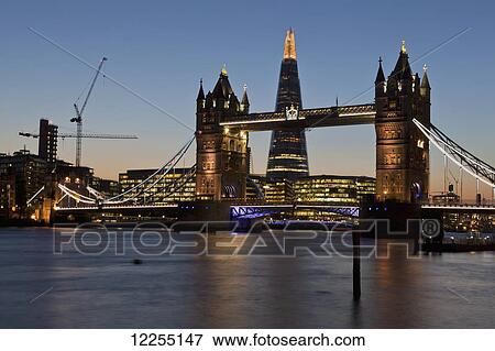 Evening view of Tower Bridge, the River Thames and the Shard building; London, England View Large Photo Image Stock Photo - Evening view of Tower Bridge, the River Thames and the Shard building; London, England. Fotosearch