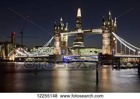 Evening view of Tower Bridge, the River Thames and the Shard building; London, England View Large Photo Image Stock Photo - Evening view of Tower Bridge, the River Thames and the Shard building; London, England. Fotosearch
