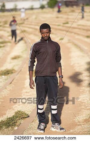 Stock Photo - Every day budding athletes train in the amphitheatre in Meskel square in central Addis Ababa; Addis Ababa, Ethiopia. Fotosearch
