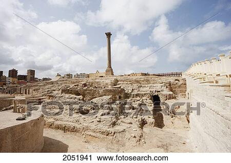 Stock Image - Excavation And Column Of Red Granite 30M Tall, Erected In 298 Ad In Honour Of The Emperor Diocletian On The Acropolis Of Alexandria. It Was Wrongly Named PompeyÃƒÆ’Ã¢â‚¬Â S Pillar By Travellers During The Middle Ages, Alexandria, Al Iskandar. Fotosearch