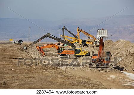 Picture - Excavators And Backhoes Digging; Israel. Fotosearch