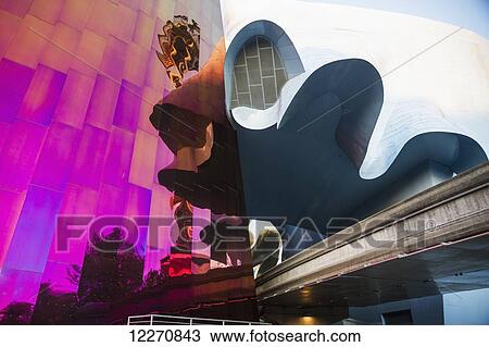Stock Image - Experience Music Project (EMP) building, designed by Frank Gehry and Space Needle at Seattle Center, Seattle, Washington, United States. Fotosearch