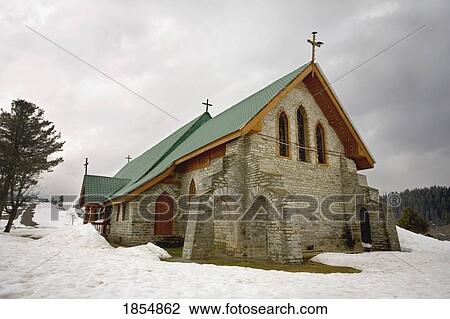 Stock Image - Exterior Of Church In Winter. Fotosearch
