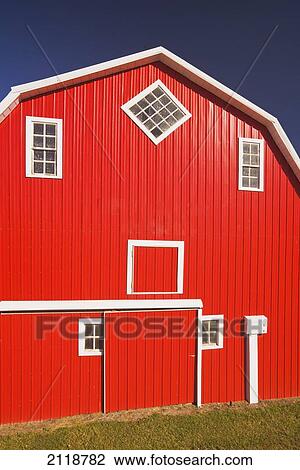 Stock Image - Exterior Of Red Barn; Woseley Saskatchewan Canada. Fotosearch
