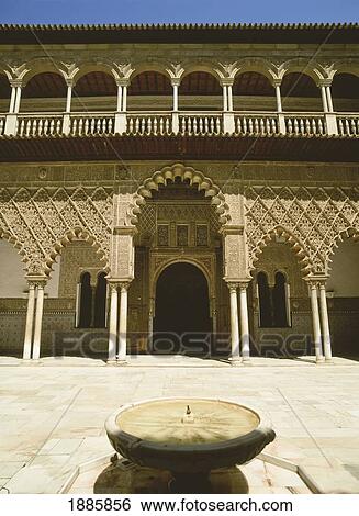 Stock Photograph - Exterior Of The Alcazar With Fountain. Fotosearch
