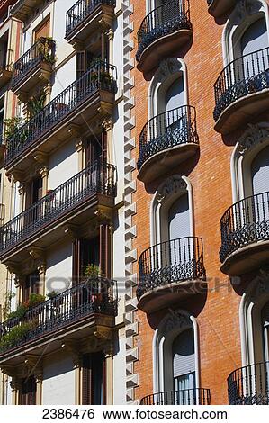 Facade of a residential building with balconies; Barcelona, Spain View Large Photo Image Stock Photograph - Facade of a residential building with balconies; Barcelona, Spain. Fotosearch