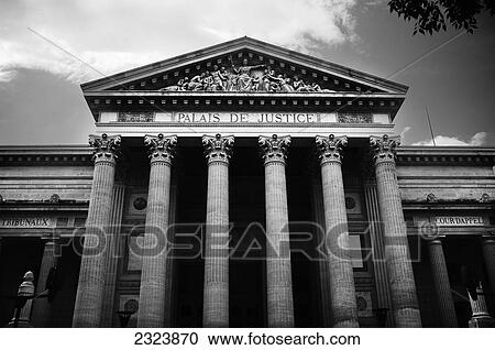 Stock Image - Facade of an ancient courthouse; Nimes, France. Fotosearch