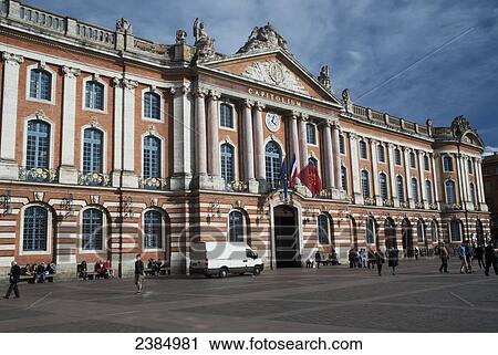 Stock Image - Facade of Capitolium and pedestrians; Toulouse, France. Fotosearch