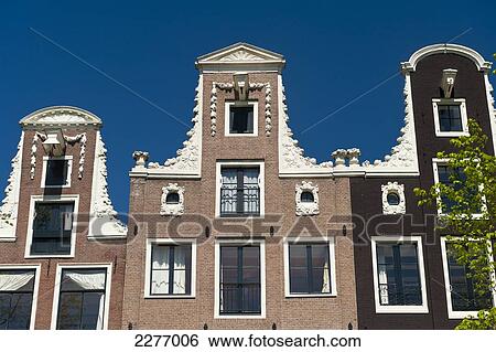 Stock Photograph - Facade of gabled houses; Amsterdam, Holland. Fotosearch