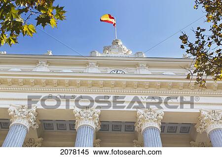 Facade Of Madrid Stock Exchange Or La Bolsa With Spanish Flag Flying; Madrid Spain View Large Photo Image Stock Photography - Facade Of Madrid Stock Exchange Or La Bolsa With Spanish Flag Flying; Madrid Spain. Fotosearch