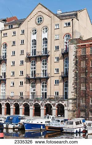 Stock Photograph - Facade Of Warehouses And Modern Flats Along Riverside; Bristol, England, Uk. Fotosearch