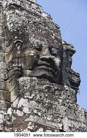Stock Image - Face Of Avalokiteshvara Guard From Bayon Temple, Angkor, Siem Reap, Cambodia. Fotosearch