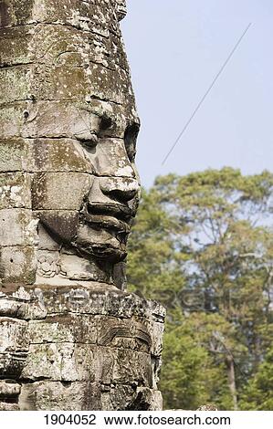 Stock Image - Face Of Avalokiteshvara Guard From Bayon Temple, Angkor, Siem Reap, Cambodia. Fotosearch