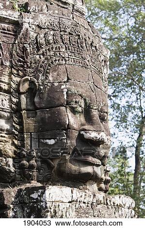 Stock Image - Face Of Avalokiteshvara Guard From Bayon Temple, Angkor, Siem Reap, Cambodia. Fotosearch