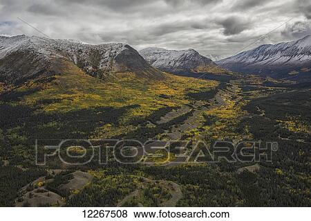 Fall colors paint the hillsides of the Ruby Mountains; Yukon, Canada View Large Photo Image Stock Photo - Fall colors paint the hillsides of the Ruby Mountains; Yukon, Canada. Fotosearch
