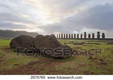 Stock Photography - Fallen Moai & Fifteen Moais From Different Periods, Restored By Archaeologist Claudio Cristino, At Ahu Tongariki At Dawn, Rapa Nui (Easter Island), Chile. Fotosearch