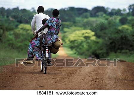 Family Cycling Home On A Dirt Road View Large Photo Image Stock Image - Family Cycling Home On A Dirt Road. Fotosearch