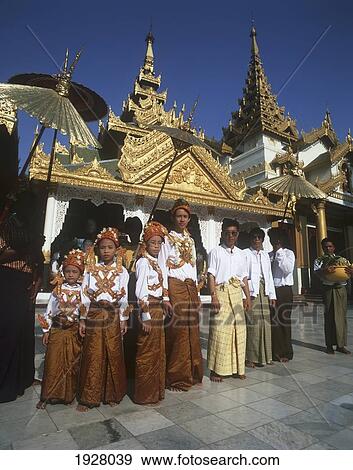 Stock Photo - Family Offerings; Shwedagon Yangon (Rangoon), Myanmar. Fotosearch