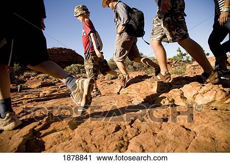 Stock Image - Family Walking In Kings Canyon, Low Angle View. Fotosearch