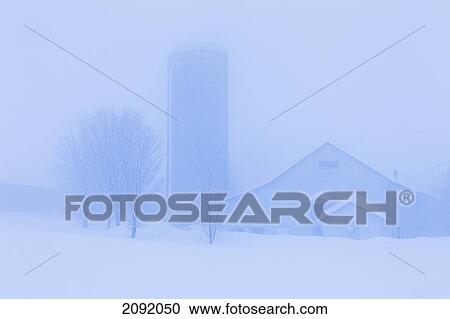 Stock Image - Farm Building In Winter Fog; Saint-Adrien-D'irlande Quebec Canada. Fotosearch
