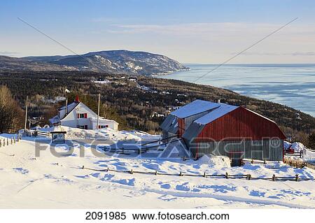 Stock Photography - Farm In Winter At Sunrise In The Charlevoix Region; Port-Au-Persil Quebec Canada. Fotosearch
