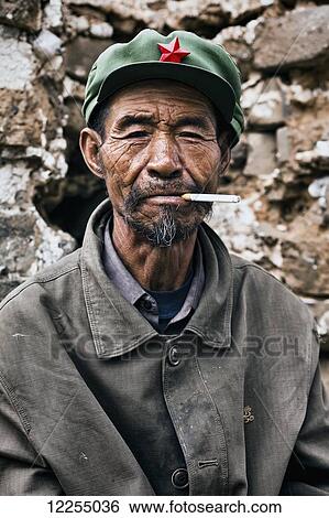 Stock Photograph - Farmer with cigarette; Hebei Province, China. Fotosearch