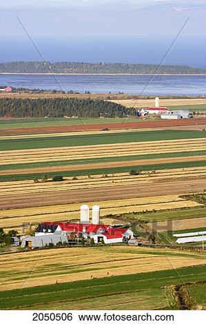 Stock Photograph - Farmland And St. Lawrence River At Sunrise, Kamouraska Village, Bas-Saint-Laurent Region, Quebec. Fotosearch