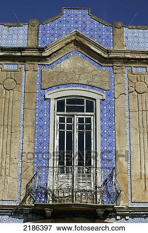 Stock Photo - Faro, Portugal. A House Covered In Colourful Azulejos, Decorative Tilework Inspired By Moorish Artistic Traditions.. Fotosearch
