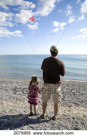 Father And Daughter Flying A Kite By Lake Ontario; Ontario Canada View Large Photo Image Stock Photography - Father And Daughter Flying A Kite By Lake Ontario; Ontario Canada. Fotosearch
