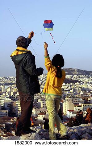 Father And Daughter Flying A Kite On Clean Monday From Hill Of Arios Pagos View Large Photo Image Stock Image - Father And Daughter Flying A Kite On Clean Monday From Hill Of Arios Pagos. Fotosearch