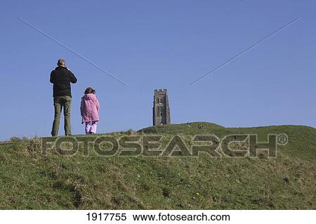 Stock Photography - Father And Daughter On Glastonbury Tor. Fotosearch