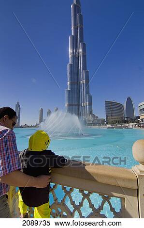 Father And Daughter Standing By Railings At Burj Khalifa, Dubai, Uae View Large Photo Image Stock Photography - Father And Daughter Standing By Railings At Burj Khalifa, Dubai, Uae. Fotosearch