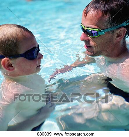 Father And Son In Swimming Goggles In Pool View Large Photo Image Stock Photo - Father And Son In Swimming Goggles In Pool. Fotosearch