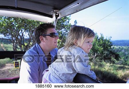 Father And Young Daughter On Safari In Jeep View Large Photo Image Stock Image - Father And Young Daughter On Safari In Jeep. Fotosearch