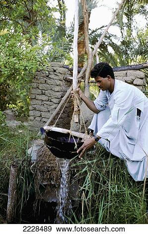 Stock Photo - Felaheen Man Operatinga Shaduf Near Luxor, Egypt.. Fotosearch