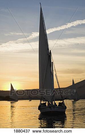Stock Photo - Feluccas On River Nile At Dusk. Fotosearch