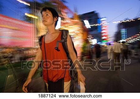 Female Backpacker Walking Along The Streets Of Delhi At Dusk View Large Photo Image Picture - Female Backpacker Walking Along The Streets Of Delhi At Dusk. Fotosearch
